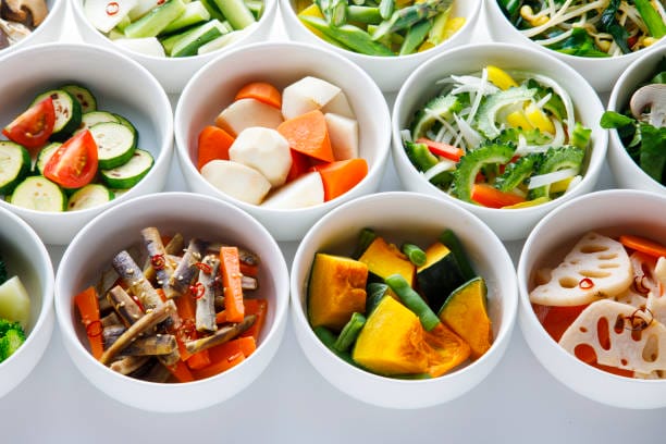 A collection of Japanese vegetables cut up for cooking and various recipes.